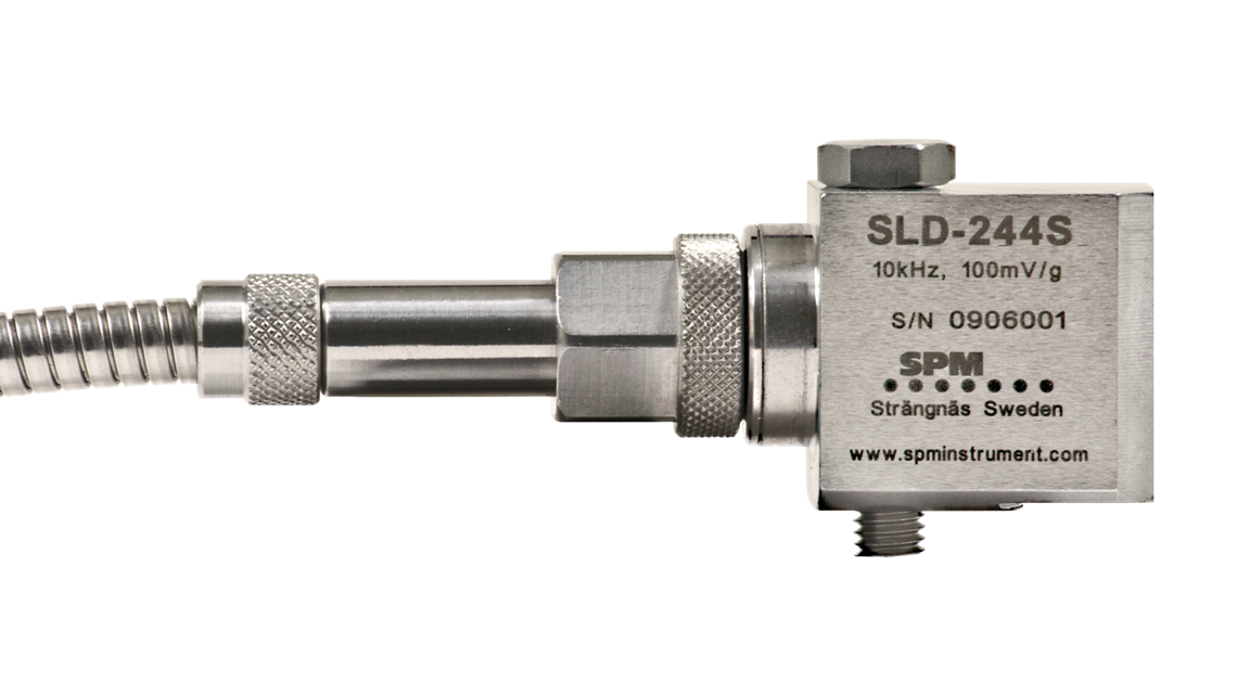 Angled vibration transducer with integrated cable